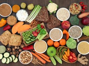 A variety of grains, fruits and vegetables are visible